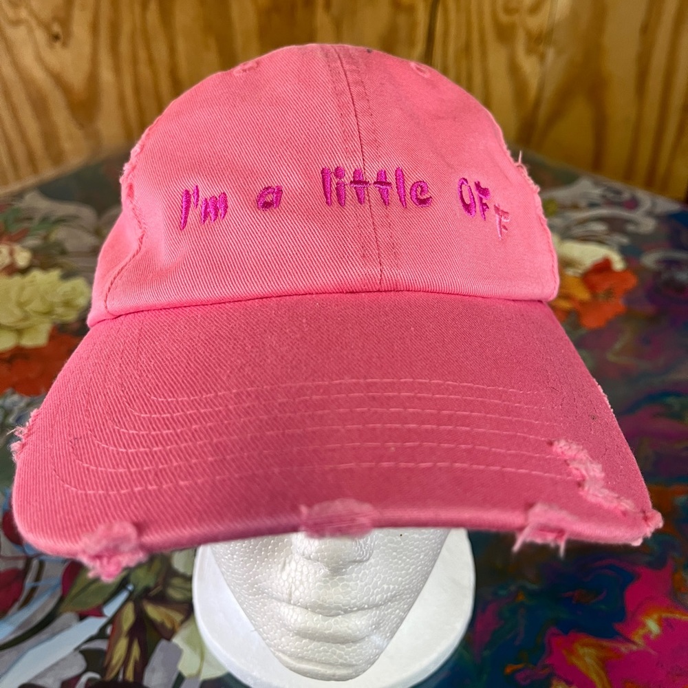 SOLD NEW Pink irregular cap. “I’m a little off” with 2 color embroidery.